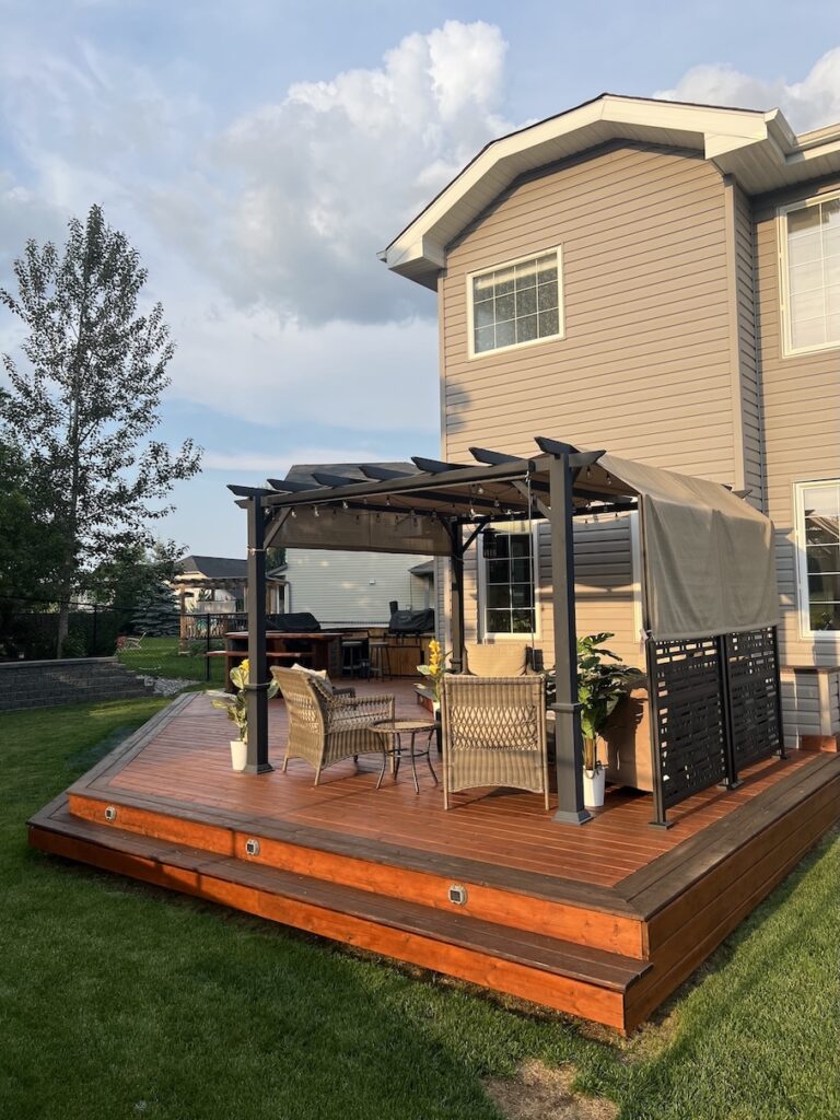 Freshly stained wooden deck with a rich brown finish in Edmonton.