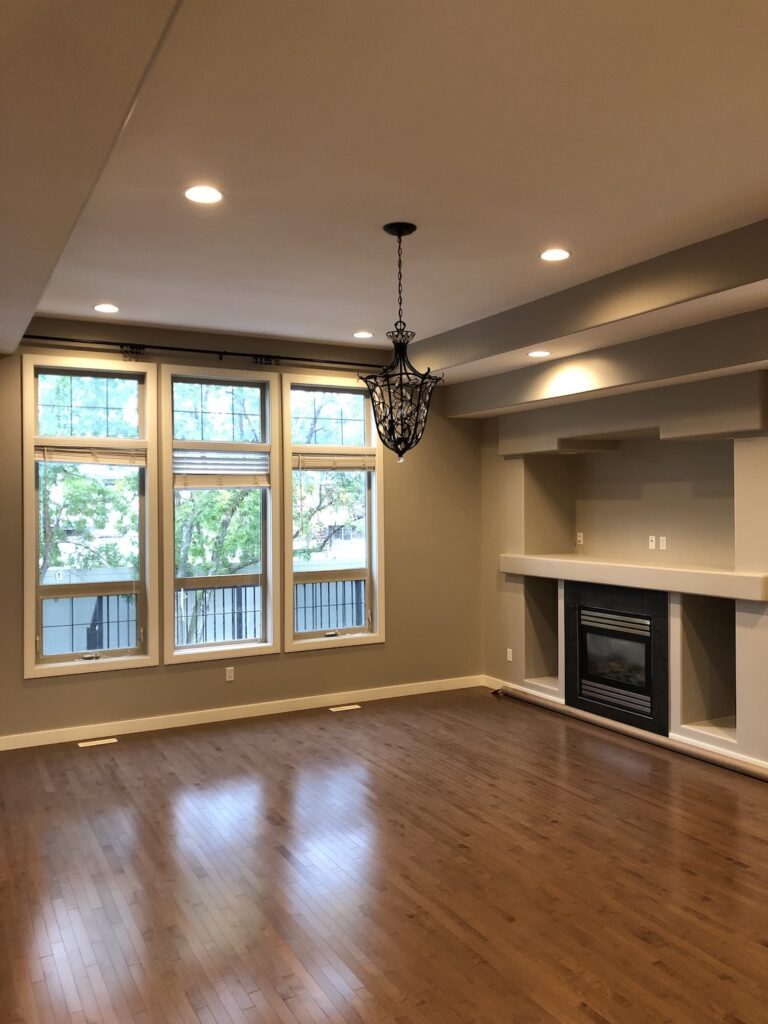 Elegant living room freshly painted in a soft beige tone by expert painters in Edmonton.
